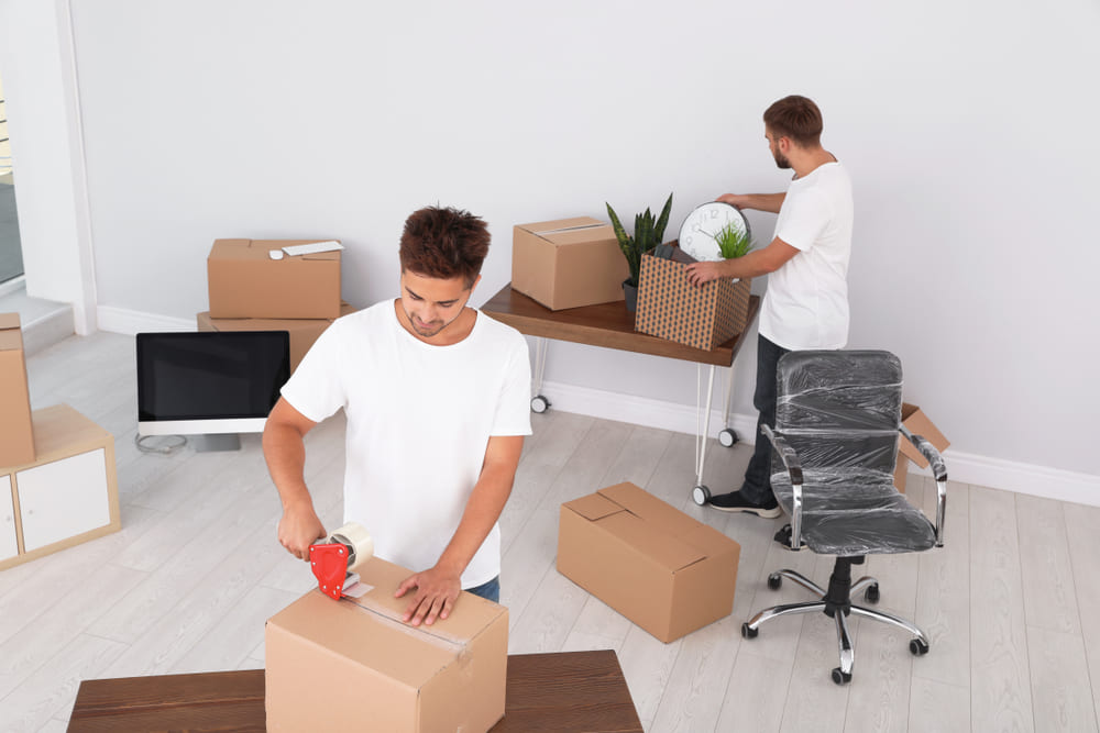 Our expert moving services in palm beach gardens fl team of movers loading furniture onto a moving truck.